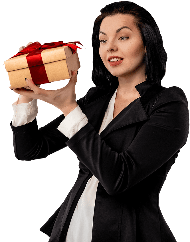 Woman holding a gift box, smiling.